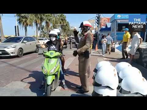 Road traffic campaign for New Year's in Pattaya continues with free helmets being given by police.